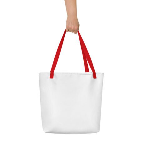 A hand holding an All-Over Print Large Tote Bag.