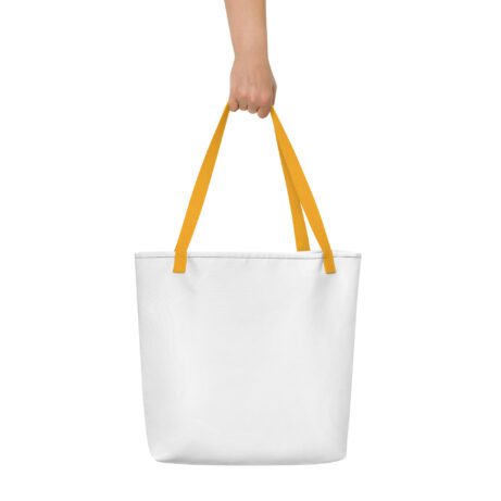 A hand holding an All-Over Print Large Tote Bag.
