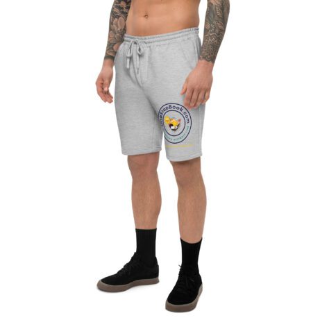 A man with tattoos wearing the Men's fleece shorts.